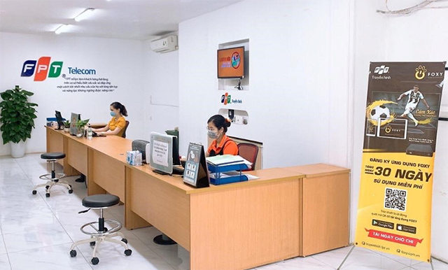 Một văn phòng FPT Telecom tuân thủ 5K mùa dịch. Hôm nay, cổ phiếu FPT Telecom đạt mốc 82.000 đồng.